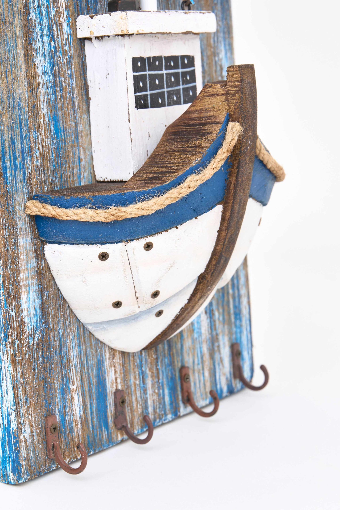 Wooden coat rack with fishing boat