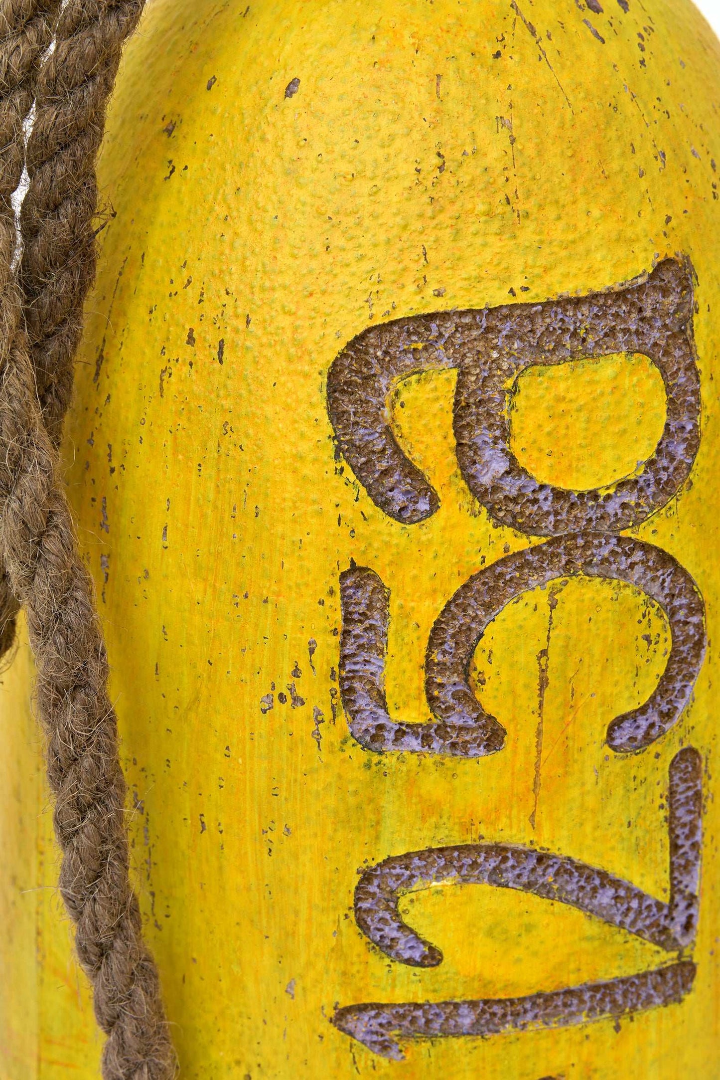 Yellow and blue decorative buoy with rope