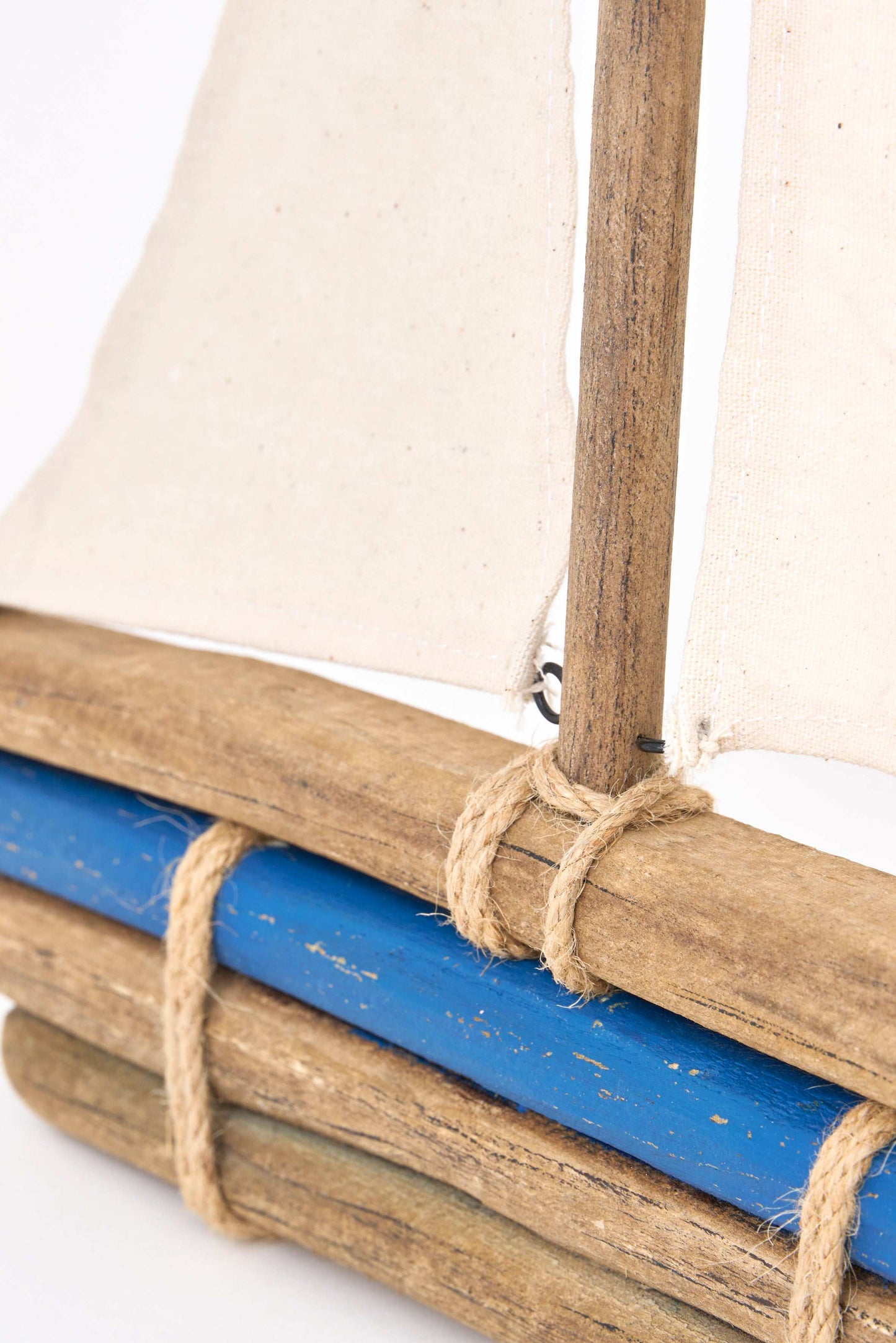 Wooden sailboat with fabric sail