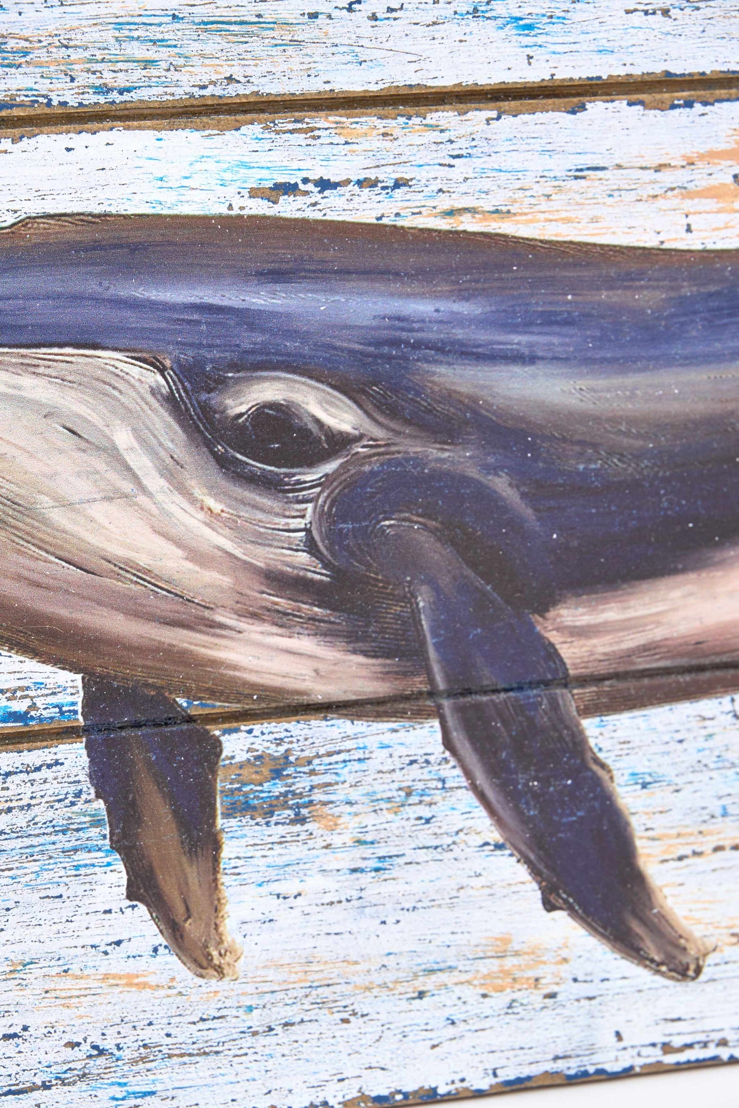 Cuadro de madera con una ballena pintada
