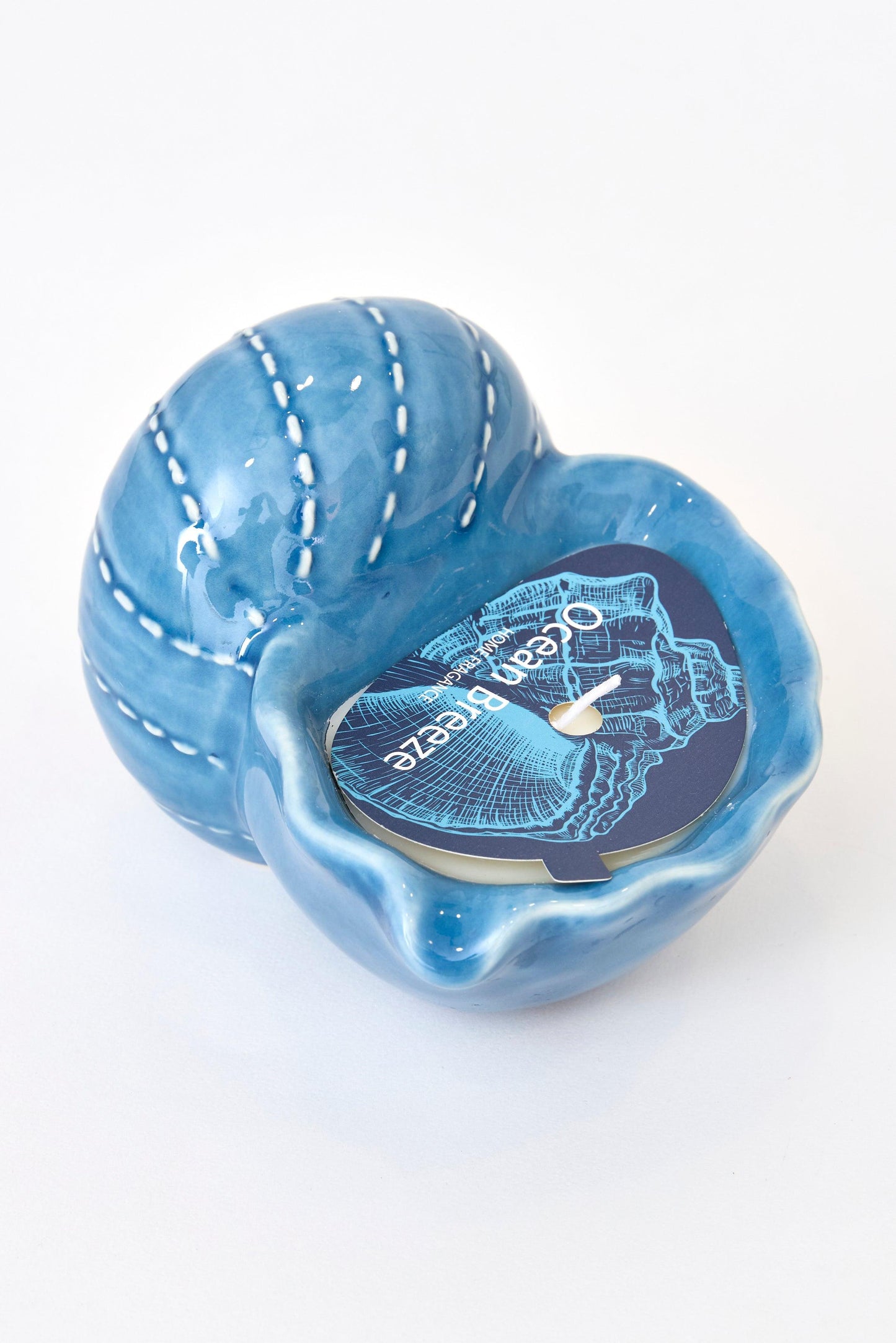 Vela decorativa en caracola azul