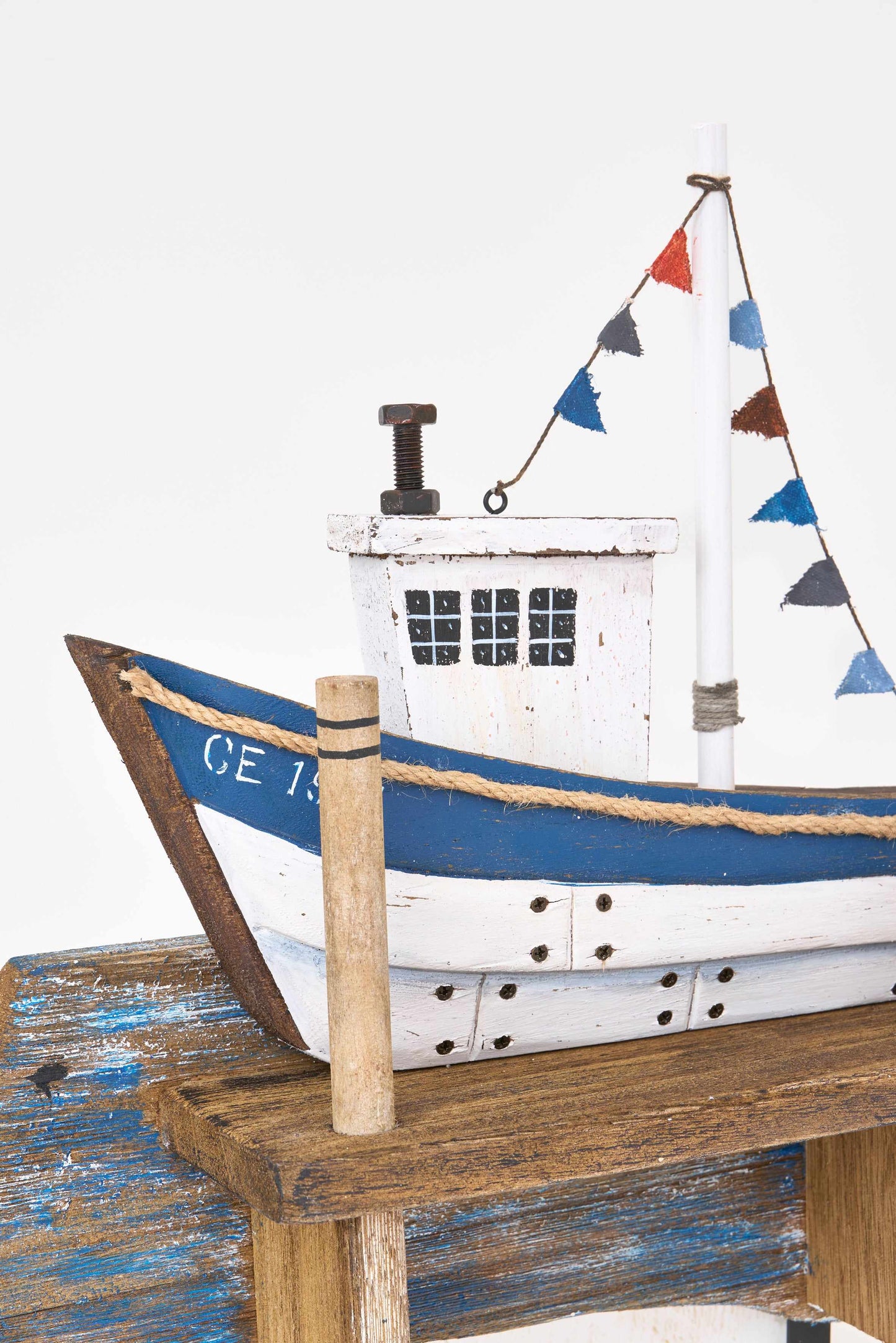 Wooden boat-shaped coat rack